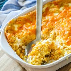 a casserole dish with a spoon in it