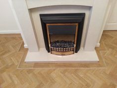 a fire place with a basket on the mantle