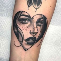 a woman's face in the shape of a heart with a lady bug on it