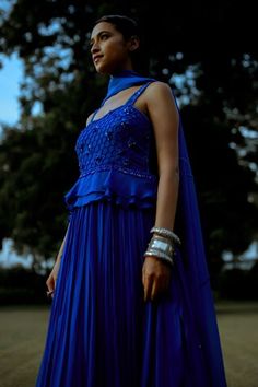 Electric blue padded gown with an attached can-can featuring moti hand work on the yoke. Paired with an organza dupatta. - Aza Fashions Festive Sleeveless Gown With Fitted Bodice, Gown With Fitted Bodice For Reception, Designer Sleeveless Embellished Gown, Fitted Bodice Gown For Reception, Blue Anarkali Gown For Formal Occasions, Sleeveless Blue Dress For Reception, Blue Dress With Fitted Bodice For Festive Season, Festive Sleeveless Blue Gown, Royal Blue Floor-length Gown For Festive Occasions