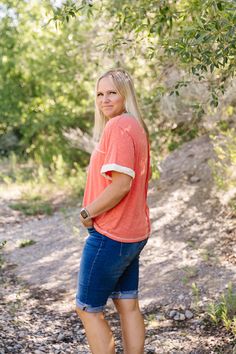 ALL SALES FINAL NOT ELIGIBLE FOR RETURN Add a pop of color to your wardrobe with the Lydia Top in a playful orange peach hue. The cream and teal contrasts add a touch of whimsy, while the v-neck and short sleeves provide a comfortable fit. Complete with accent stitching for a unique touch. Fits true to size. Model is wearing a large and is 5'5". Plus model is wearing a 1X and is 5'6". Size Chart Length Bust S 22" 42" M 23" 44" L 24" 46" 1x 25" 48" 2x 26" 51" 3x 27" 54" *All measurements are appr Orange V-neck T-shirt For Summer, Tiered Dresses, Plus Model, Teen Dress, Spring Fits, Jean Top, The Cream, White Outfits, Top Sales