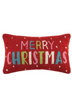 a red christmas pillow with the words merry christmas on it's front and back