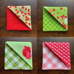 four folded napkins sitting on top of a wooden table