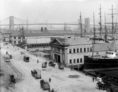 an old black and white photo of a harbor with many ships in it's dock