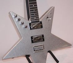 a guitar shaped like a star on display