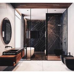 a bathroom with black and white marble walls