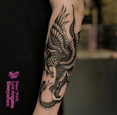 a man with a dragon tattoo on his arm