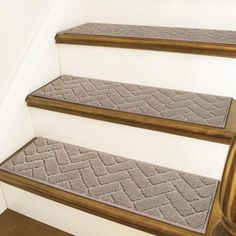 carpeted stair treads on the side of a staircase