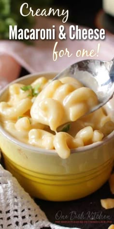 creamy macaroni and cheese for one in a yellow bowl with a silver spoon