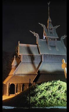 an old church lit up in the dark