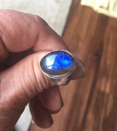 This is a very unique ring I purchased in a vintage jewelry auction. Set in the antique silver plated setting is one beautiful chunk of oval BLUE LABRADORITE gemstone. The stone is not to large as you can see in the photo's. The ring is stamped 925 (very difficult to see, but it's there). The ring shows very little wear... mint condition! The ring is sterling silver over copper base. Ring Size: 9 Blue Rings With Large Stone For Healing, Blue Oval Moonstone Ring, Blue Labradorite Ring, Blue Labradorite Rings For Gift, Unique Blue Labradorite Ring, Blue Labradorite Rings As Gift, Blue Labradorite Moonstone Ring, Blue Labradorite Rings For Gifts, Gift Blue Labradorite Rings