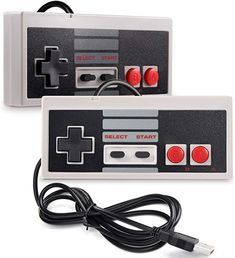 an old nintendo game console with two controllers and a charger plugged into it