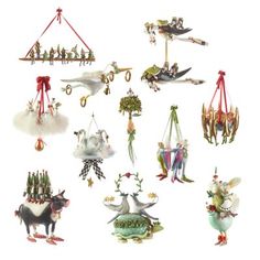 an assortment of christmas ornaments hanging from strings and hooks on a white background with clippings