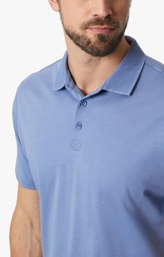 This polo has a three-button neckline with a textured collar for subtle flair. Designed for a close fit that is both flattering and easy to move in, this top will keep you stylish and comfortable from dawn to dusk. The vintage indigo hue offers a perfect blend of luxury and versatility.  - - - Measurements based on a size Large. 22.5" chest 25.6" back length 18.5" shoulder to shoulder Fabric: 100% Pima Cotton Machine Wash Cold Made in Turkey Item: H0611791-86828 Dark Comfort, Tapered Chinos, Mens Polo T Shirts, Belt Top, Vintage Indigo, Polo T Shirt, Blazer Fashion, Move In, T-shirt Polos