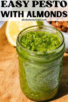 pesto with almonds in a mason jar on a cutting board