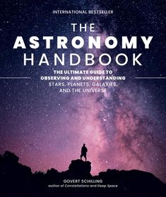 the astronomy hand book with an image of a man standing on top of a hill