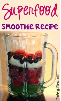 a blender filled with fruit on top of a counter