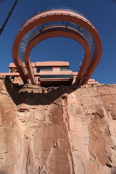 a large building sitting on top of a cliff