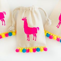 three bags with pink llamas on them