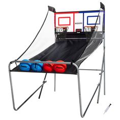 a chair with three balls in it and a basketball net on the back ground next to it