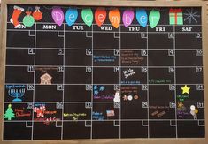 a chalkboard calendar with holiday decorations on it