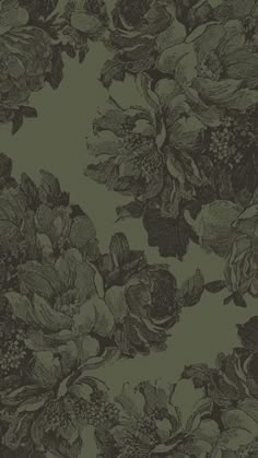 a green floral wallpaper with black and white flowers