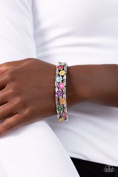 Held together by dainty multicolored flowers, rows of linear-textured cylindrical silver beads are threaded along stretchy bands around the wrist, coalescing into bold, whimsical layers. Sold as one individual bracelet Multicolored Flowers, Jewelry Catalog, Trends 2023, Toggle Bracelet, Paparazzi Accessories, Stretchy Bracelets, Flower Clip, Paparazzi Jewelry, Tassel Earrings