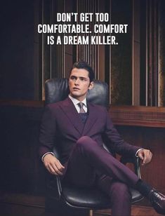 a man in a suit sitting on a chair with a quote above him that says, don't get too comfortable to comfort a dream killer is a dream killer