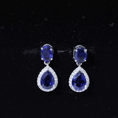 Product Details These Classic Dangle Earrings are embellished with Oval Cut Created Blue Sapphire Gemstone from which Pear Cut Created Blue Sapphire Gemstone is hanged which is encircled with Round Cut Moissanite in Halo Style, crafted in a Solid Gold. Product Information SKU SHP-EARRINGS042171631 Weight 2.76 gm (Approximate) LAB CREATED BLUE SAPPHIRE INFORMATION No.of Stones 4 Pieces Total Weight 5.20 Carat (Approximate) Dimension(approx) Oval-5X7 mm-2 PcsPear-6X8 mm-2 Pcs Color Blue Cut Brilli Blue Sapphire Gemstone, Halo Style, Signature Jewelry, Timeless Jewelry, Sapphire Gemstone, Silver Earrings Dangle, Pear Cut, Conflict Free Diamonds, Free Jewelry