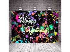 an image of a birthday party backdrop with colorful paint splattered on the wall