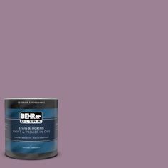 a can of behr paint on a blue background