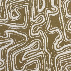 a brown and white pattern on fabric that looks like an abstract design with wavy lines