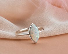 * Stunning handmade solid gold opal ring. This ring is designed to look elegant from all sides of your finger. You will not be able to take your eyes off the fascinating color of opal stone and the magnificent glitter of solid gold. 14K and 18K options are avaliable. It is suitable for daily use * ★Item Details ♥Made to Order ♥Gold Kt: 14K & 18K ♥Available Gold Color: Gold, Rose Gold, White Gold ♥Opal Stone Size: 10 x 05 mm Marquise ♥Ready to Ship in 1 - 3 Business Days ✔ Shipped to the Worl Oval Opal Ring With Polished Finish For Wedding, Opal Ring With Bezel Setting, Opal Wedding Jewelry With Polished Finish, Wedding Opal Jewelry With Polished Finish, Marquise Opal Jewelry As A Gift, Sterling Silver Opal Ring With Bezel Setting For Wedding, Marquise Opal Jewelry For Gift, Marquise Opal Jewelry Gift, Opal Marquise Jewelry For Gifts