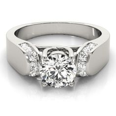 a white gold engagement ring with diamonds on it