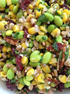 a white bowl filled with mixed vegetables and grains