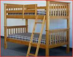 a wooden bunk bed with blue and white checkered bedspread on the bottom