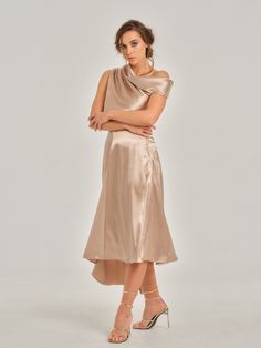 This spectacular midi skirt is entirely made from, and fully lined with, a luxurious silky satin fabric that creates a light and soft feeling of enjoyment. It drapes beautifully and gracefully falls from the fitted waist into a flared asymmetric hemline. The skirt’s A-line silhouette sensibly flatters the body and elegantly moves in harmony with it.  This design is a tribute to empowerment of the modern fierce woman and celebrates her worth. It is an exceptional choice for your formal occasion o Asymmetric Shirt, Midi Skirt Outfit, Fierce Women, Asymmetric Skirt, Spring Suit, Soft Feeling, Gifts For New Mums, Asymmetrical Skirt, Satin Top