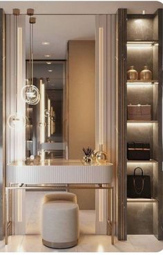 an elegant dressing room with mirrored walls and gold accessories on the shelves, along with a stool