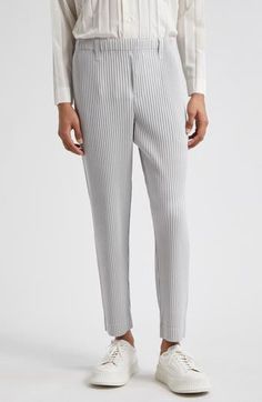 Issey Miyake's signature garment-pleating technique gives modern shape to these wrinkle-resistant and travel-friendly pull-on pants in a straight-leg cut. 28" inseam; 14" leg opening; 12 1/2" front rise; 15 1/2" back rise (size 2) Elastic waist 100% polyester Dry clean or machine wash, line dry Imported Designer Clothing Asian Owned/Founded Spring Workwear Bottoms With Folds, Pleating Technique, Issey Miyake, Pull On Pants, Bottoms Pants, Light Gray, Light Grey, Designer Clothing, Elastic Waist