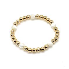 Bracelet with pearl and gold beads. 14K gold filled 5mm beads and 6mm mother-of-pearl beads. Gold-plated Yellow Gold Pearl Bracelet Gift, Gold Mother Of Pearl Bracelet For Wedding, White 14k Gold-filled Beaded Bracelets For Wedding, Gold-tone Gold-plated Pearl Bracelet Gift, Maid Of Honor And Bridesmaid, Elegant Bridal Party, Gold 14k Gold-filled Round Beads Pearl Bracelet, Minimalist Bracelets, Bracelet Trio