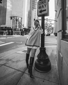 Black and white image of a woman standing by a street lamp and sign in the streets of downtown Nashville. City Lifestyle Photography, Downtown Branding Photoshoot, Downtown Photoshoot Aesthetic, Edgy Branding Photoshoot, Archery Knowledge, Writer Branding, Downtown Portraits, Downtown Lifestyle, Mua Photoshoot