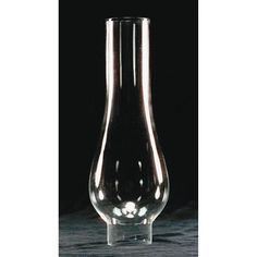 a clear vase sitting on top of a table