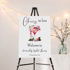 a welcome sign is displayed on an easel