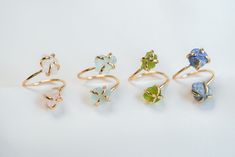 Discover the perfect personalized touch with our adjustable raw gemstone rings crafted from 18K gold-plated copper. Each ring features two exquisite raw gemstones, allowing you to choose from a stunning array of birth month stones, including Garnet, Amethyst, Aquamarine, Diamond, Emerald, Moonstone, Ruby, Peridot, Sapphire, Rose Quartz, Citrine, and Lapis Lazuli. Embrace meaningful elegance and make a unique statement with this customizable and beautifully crafted accessory. Ring Details - 18K Gold plated copper - Ring is adjustable between US size 6 and US size 11 - Garnet (January) - Amethyst (February) - Aquamarine (March) - Diamond (April) - Emerald (May) - Moonstone (June) - Ruby (July) - Peridot (August) - Sapphire (September) - Rose Quartz (October) - Citrine (November) - Lapis Lazu Adjustable Yellow Gold Crystal Ring With Gemstone, Adjustable Crystal Ring With Raw Stone For Gift, Handmade Adjustable Yellow Gold Birthstone Ring, Adjustable Gold Rings With Raw Stone, Birth Month Stones, Adjustable Gold Ring, Two Stone Ring, October Birthstone Ring, Raw Gemstone Ring