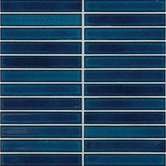 a blue tile wall with horizontal lines in the middle and diagonals on each side