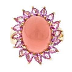 Decorate yourself in elegance with this Ring is crafted from 14K Yellow Gold by Gin & Grace. This Ring is made up of 11x14 mm Oval-Cab (1 pcs) 5.49 carat Pink Opal and Round-cut Pink-Sapphire (16 pcs) 2.85 carat. This Ring is weight 4.51 grams. This delicate Ring is polished to a high finish shine. Gin And, Pink Opal Ring, Pink Ring, Opal Ring, Delicate Rings, Pink Opal, Opal Rings, Pink Sapphire, Cocktail Rings