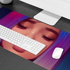 a computer mouse pad with a woman's face on it and a keyboard next to it