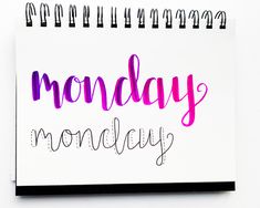 a notepad with the words monday monday written in pink and purple ink on it