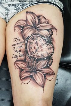 a woman's thigh with a clock and flower tattoo on her leg that reads the moment i met you truly ride