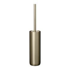 a metal toilet brush holder with a gold finish on an isolated white background for use in the bathroom